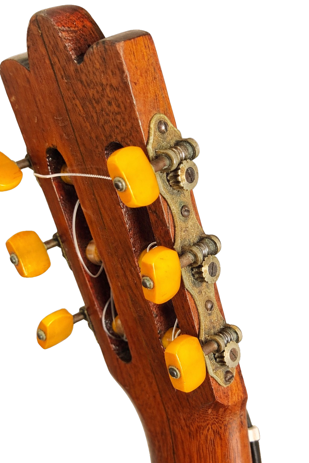 Original brass tuning machines with amber celluloid buttons
