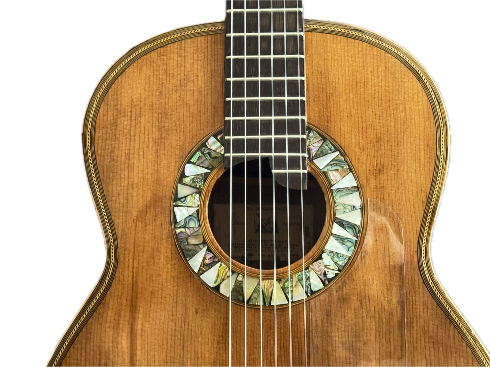 Close-up of hand-cut abalone rosette around the soundhole